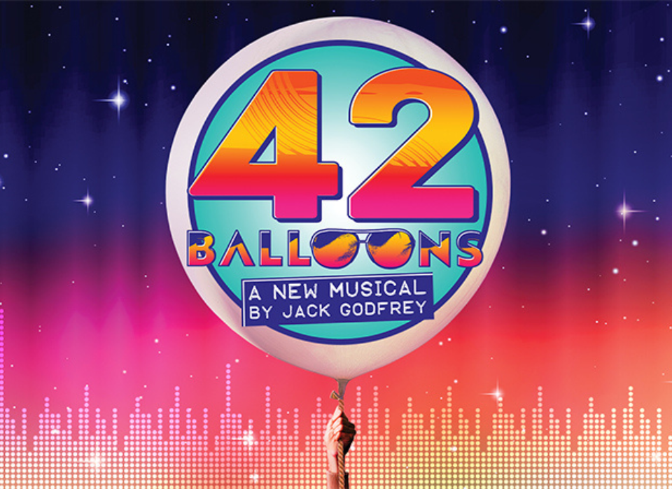 "42 Balloons," a new musical by Jack Godfrey, featuring a large balloon with colorful text against a night sky background.
