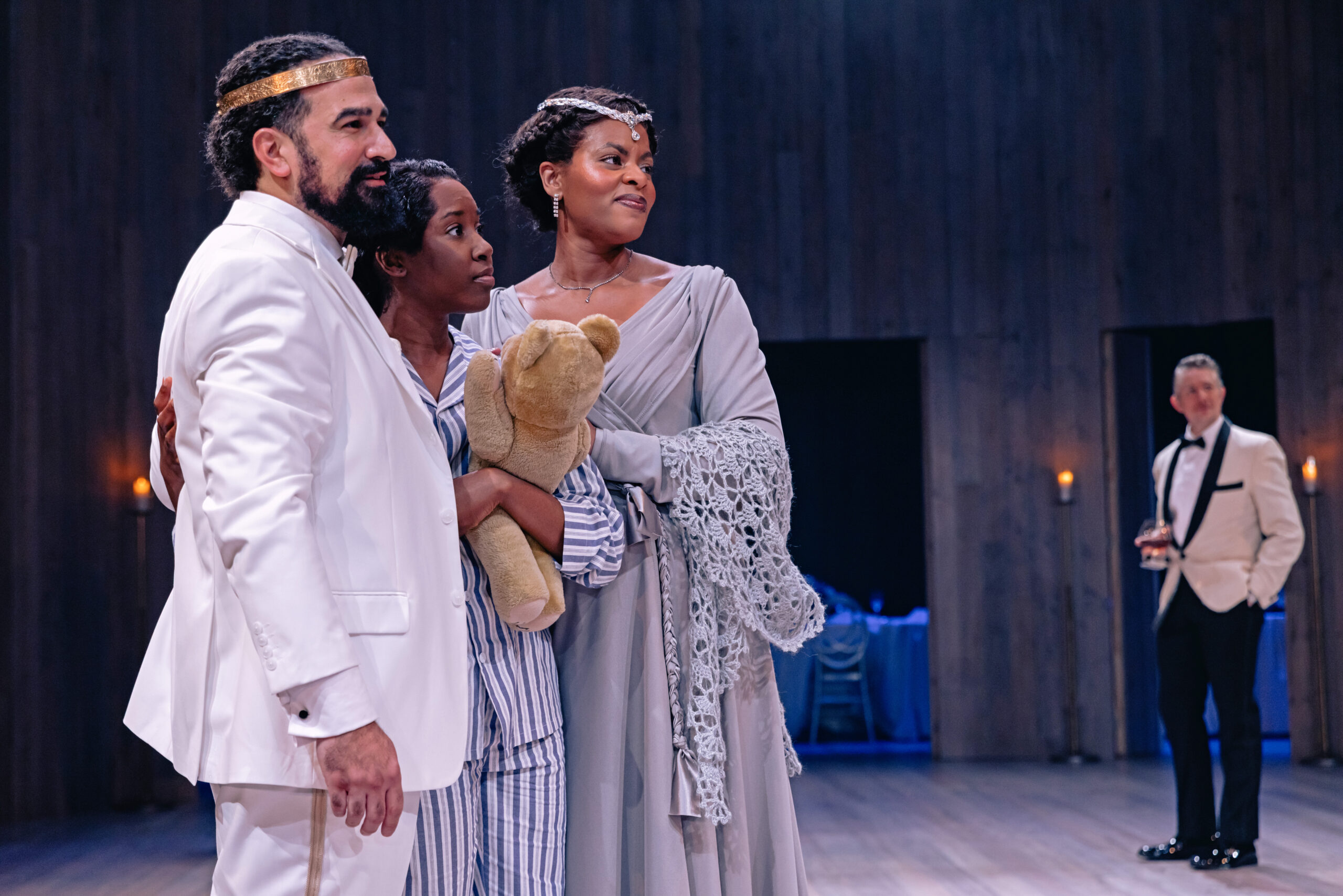  Demetrios Troy, Felicia Oduh, and Jessica Dean Turner hug as the royal family of Scilia 